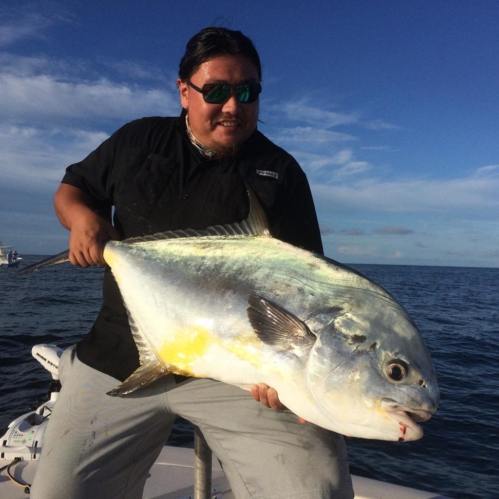 A fisherman who caught a permit with chasin tales charters on a southwest florida fishing charter.